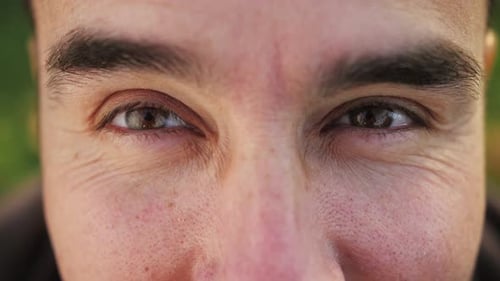 Close Up of Man Face Opening Hazel Eyes Young Arab Male Model Smiling Looking at the Camera