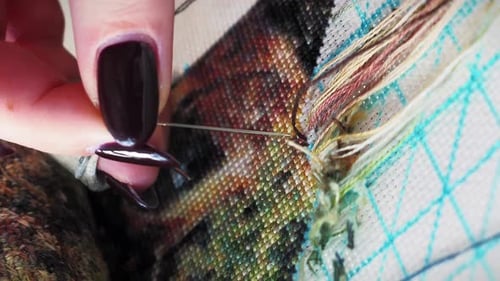 Woman Doing Counted Cross Stitch Close Up