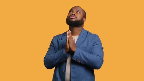 Man Praying to His God Asking for Forgiveness Studio Background