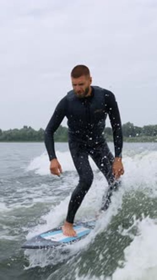 Man wake surfing on a lake