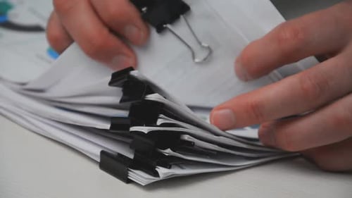 Stack of Papers Folder on Work in Office