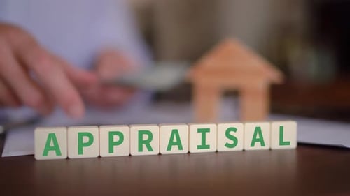 Concept of real estate appraisal after renovation. Selective focus with man counting cash in the bac