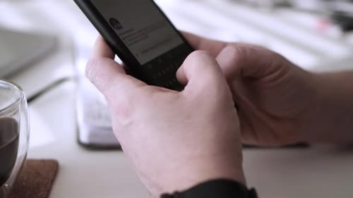 Man scrolling social media in smartphone