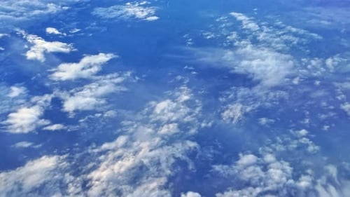 Flying above the clouds view from an airplane window