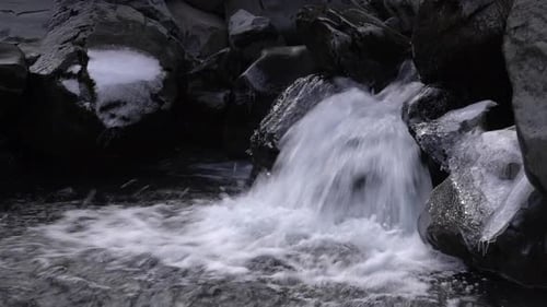 Water From Grundarfoss Waterfall Cascades Into The Rocky River In Snaefellsnes Peninsula, Iceland. -