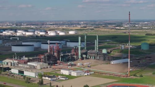 Aerial Industrial Refinery Complex with Storage Tanks and Smokestacks