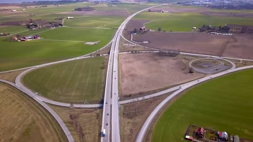 Aerial View of Freeway Intersection with Moving Traffic Cars