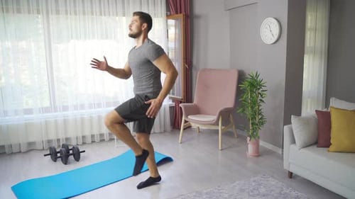 Man Doing High Knees in Living Room