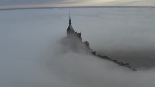 Aerial view of Mont Saint-Michel in fog, France.