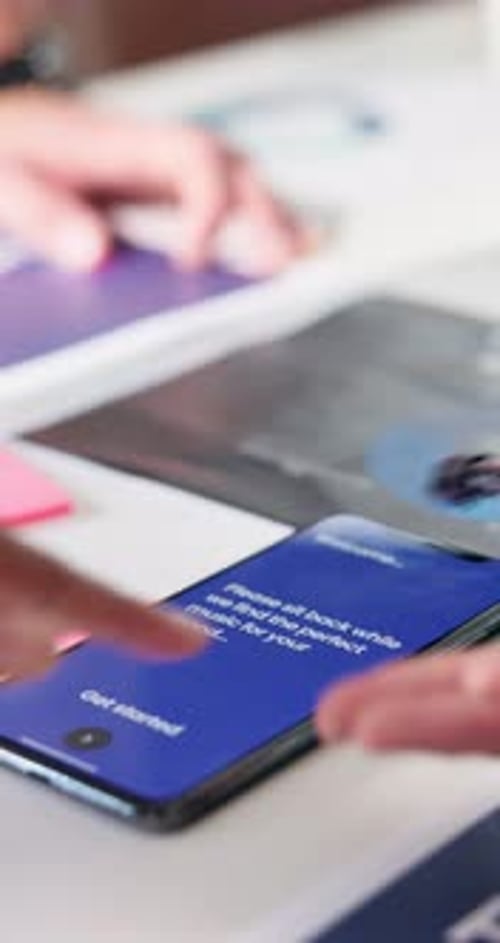 Business people, hands and phone with screen for app, software development or meeting at office