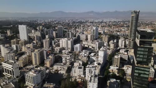 Aerial view of the evening city from above. High-rise building and urban development.