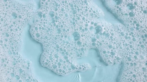 Light Blue Fluid with White Bubble Foam