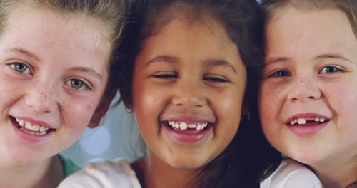 Three Happy Young Girls Smiling at Camera