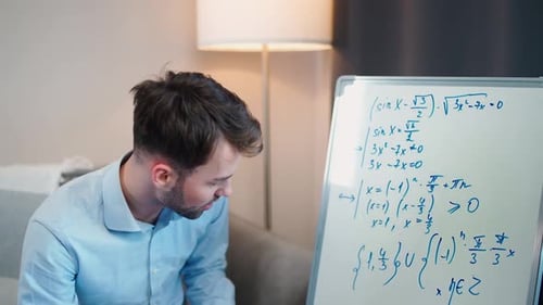 Young Adult Tutor Explaining Math Equations