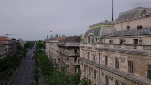 Forwards Fly Over Roofs of Old Multistorey Apartment Houses in City Centre Striped Red and White