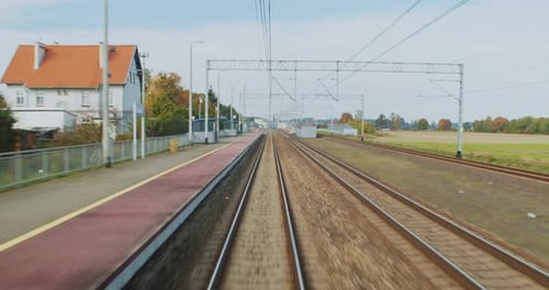 View From the Window of the Last Car of the Train to the City and the Landscape