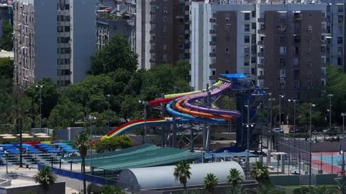 Aerial view of water park, people having fun in water slide in water park