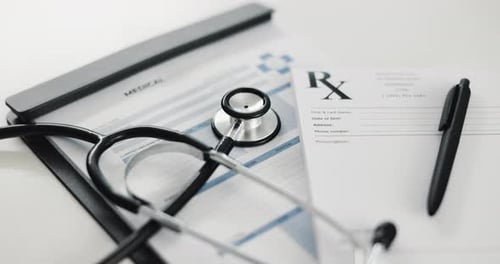 Clipboard, documents and stethoscope on desk, clinic and empty for writing prescription