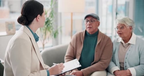 Consultant Meeting With a Senior Couple at Home