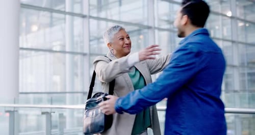 Business, welcome and a man hugging a woman in the office, greeting a colleague with a friendly