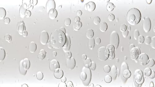 Floating Bubbles in Clear Liquid Macro Shot