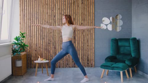 Young Woman Practicing Yoga at Home