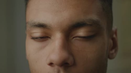 Black Man Eyes Opening Close Up African American Face Smiling Looking at Camera