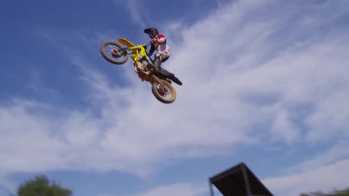 Man On Dirt Bike Performing Stunt