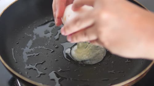 An Egg Broken Into the Pan