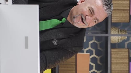 Adult Male In Office Speaking to Camera