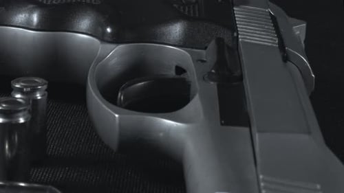 Gun And Bullet On The Table 1