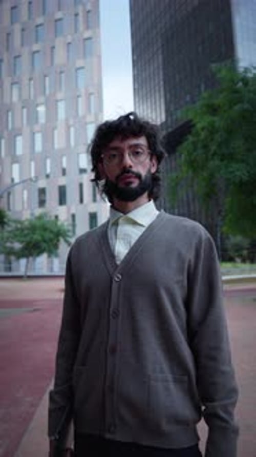 Confident Man with Glasses in Urban Business District