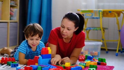 Mother and Child Play Together with Colorful Blocks