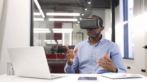Man Wearing VR Headset at Workplace
