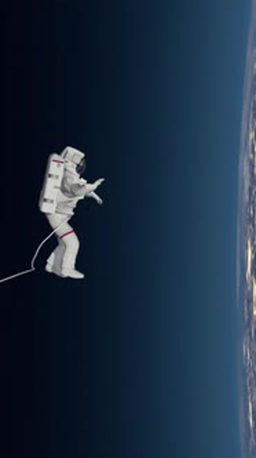 Astronaut Spacewalk, waving his hand in the open space.