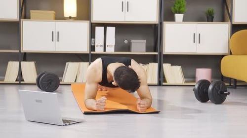Fitness trainer teaching plank exercise.