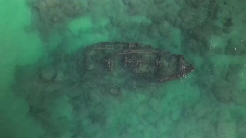 Aerial View Of Tourists Paddle Boarding By Shipwreck In Ocean, Tourists Enjoying Vacation – Arsuf