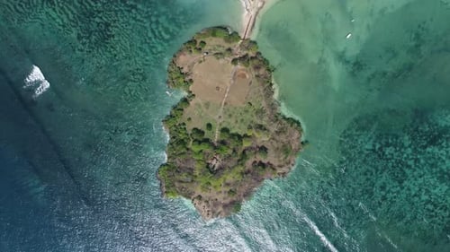 Bali's Tranquil Paradise: Aerial 4K Drone Shot of Nusa Dharma Island; Luxury Resorts, Turquoise Wate