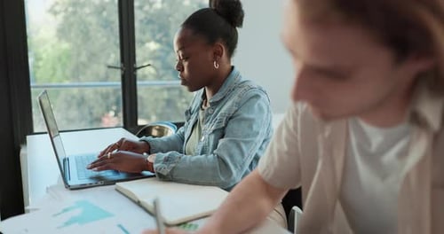 People Working Together at Desk with Computers