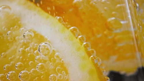 Close Up of Citrus Slices in Soda