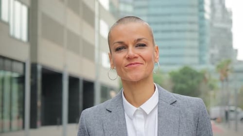 Close Up Individual Fotage of a Businesswoman Smiling and Looking at Camera with Proud Expression