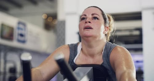 4k footage of a woman looking exhausted after her workout at the gym