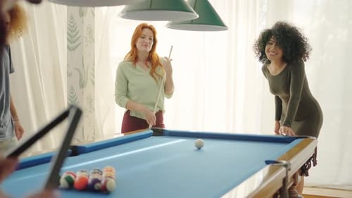 Friends Starting to Play Pool at Home