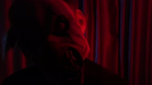 Close Up of Scary Man with Evil Clown in Red Room