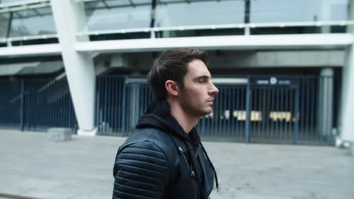 Rocker Man Walking Street in Black Jacket in . Portrait Of