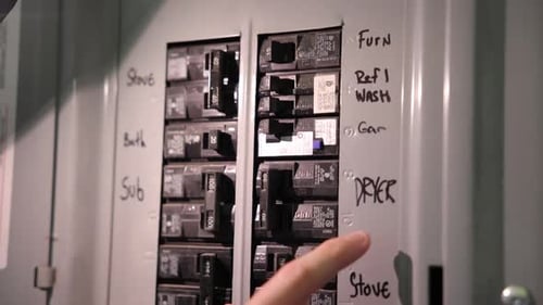 Hand Flips Circuit Breaker Switches