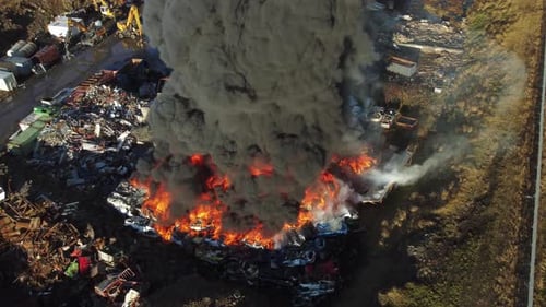 Huge Fire at Car Junkyard Black Oil Smoke Pollutes the Atmosphere Ecological Disaster Global Warming