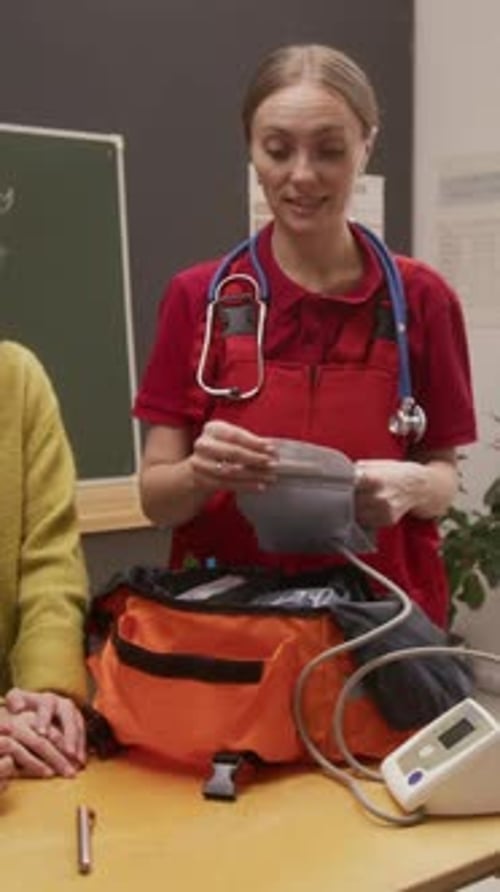 Doctor Showing Medical Devices to Children Vertical