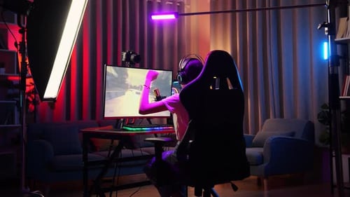 Asian Girl Streamer Celebrating Winning Game On Computer. Live Stream Video Game