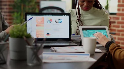 Diverse Team Analyzes Data in a Modern Office